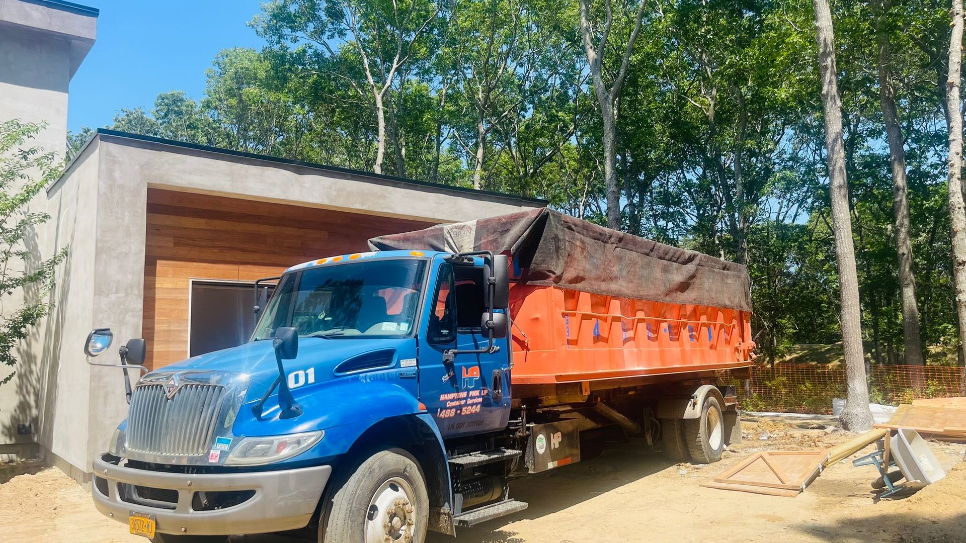 A Hamptons Pick Up 15-yard roll-off dumpster on the East End of Long Island