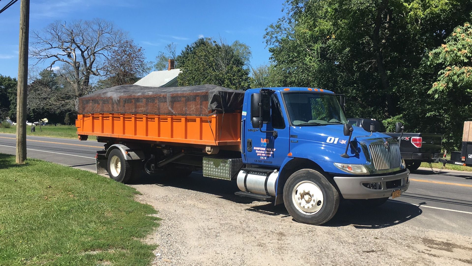 A Hamptons Pick Up 20-yard roll-off dumpster on the East End of Long Island